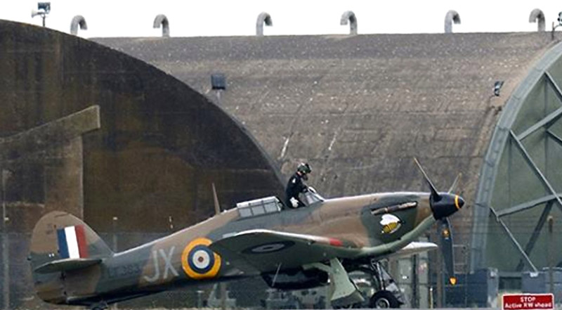 Sqn Ldr ‘Disco’ Discombe climbs out of BBMF Hurricane LF363